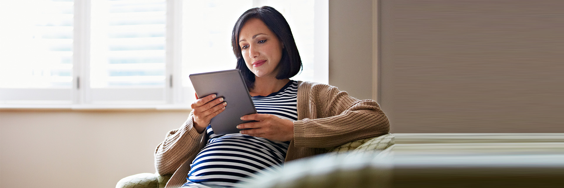 Pregnant Woman using tablet