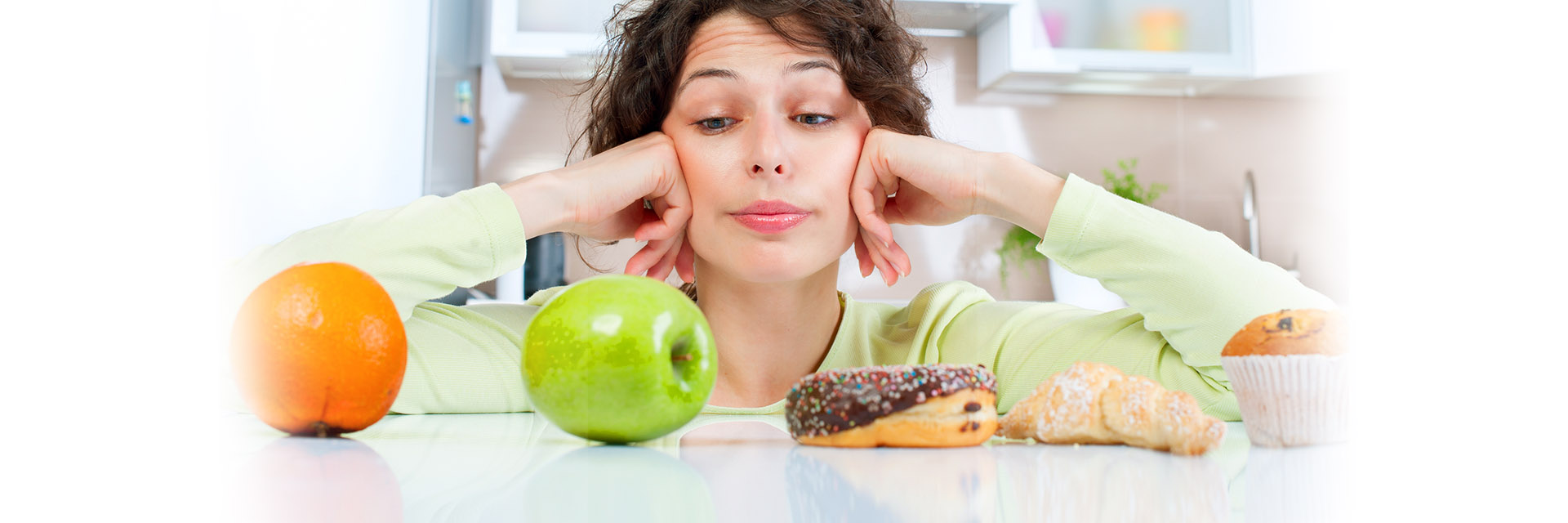 Woman looking at good food and bad food