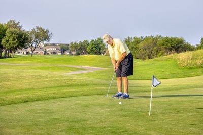 Don Gustovich playing golf