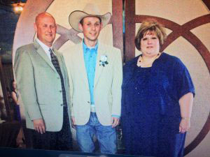 McGuire alongside her husband and son at his wedding in 2008. Photo courtesy of McGuire.