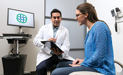 Doctor showing patient tablet