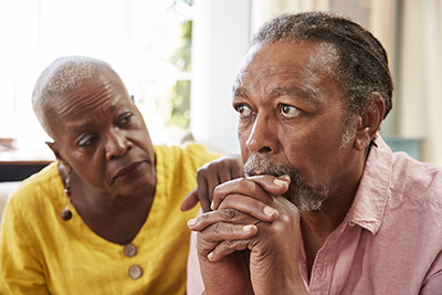 Sad man with wife