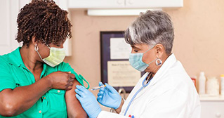 Woman getting vaccine shot
