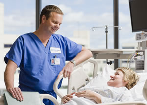 Male nurse speaking with patient