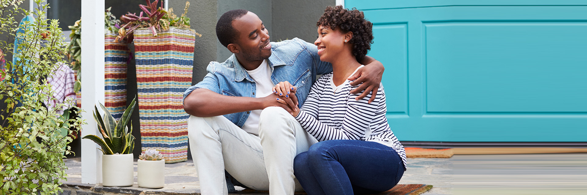 Couple Sitting on Steps Holding Hands