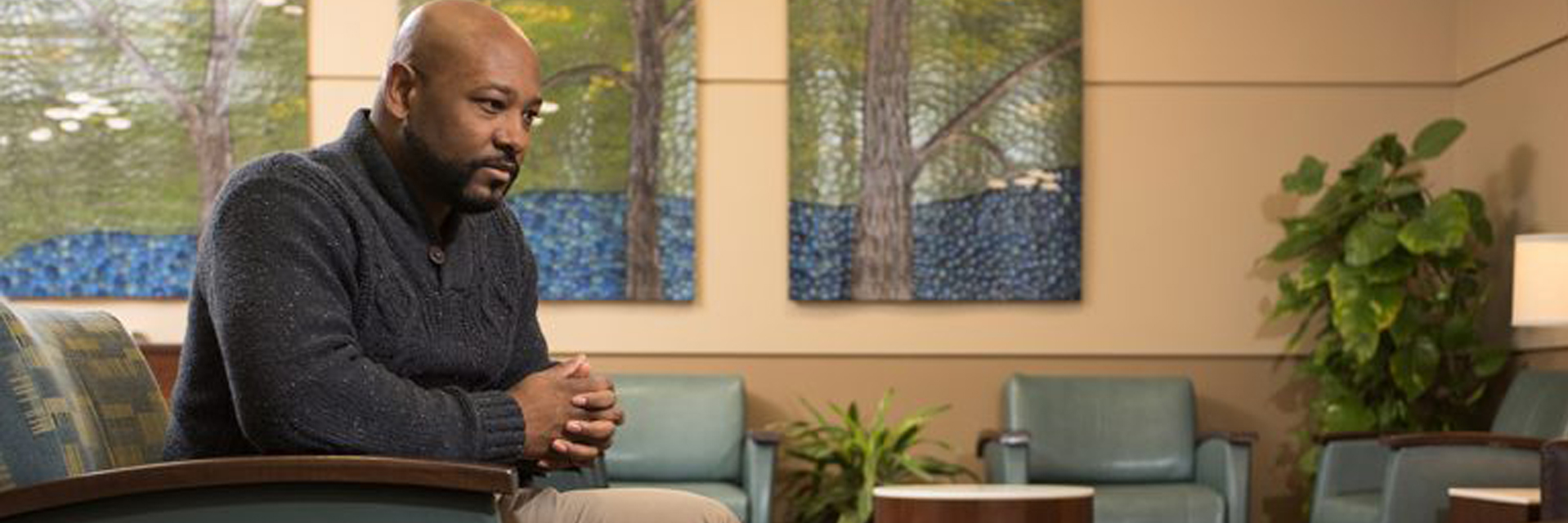 Concerned Depressed Male Sitting in Chair