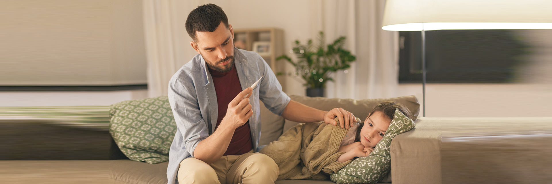 Father with daughter sick in bed