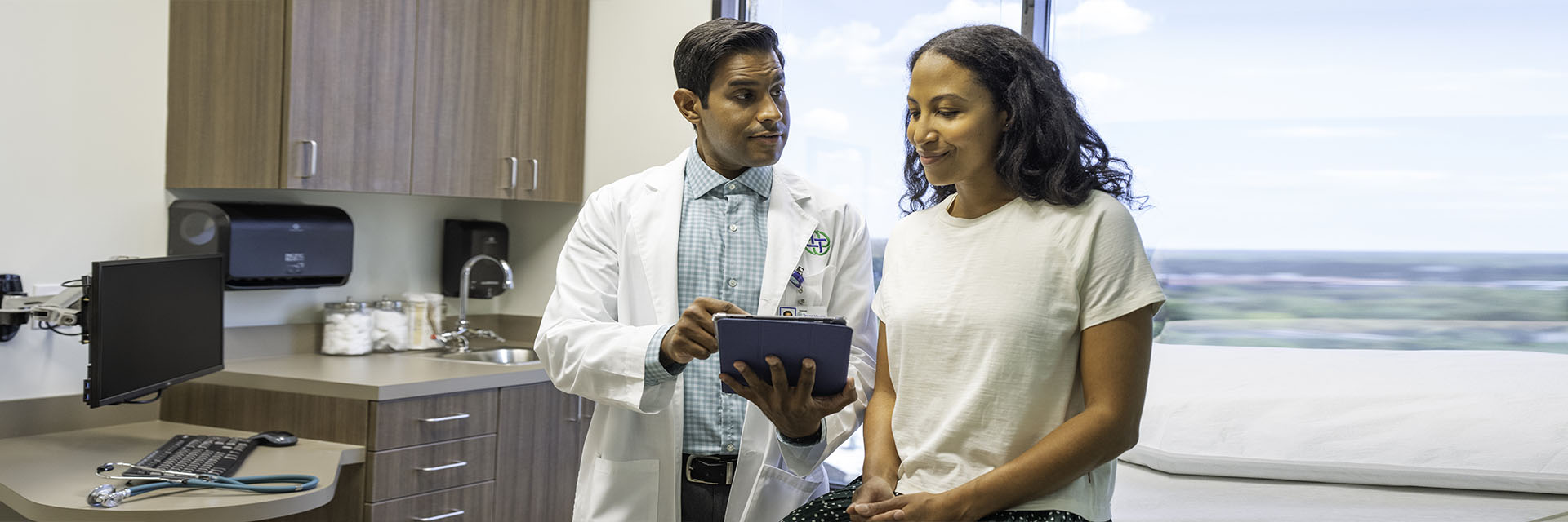 Woman reviewing information with doctor