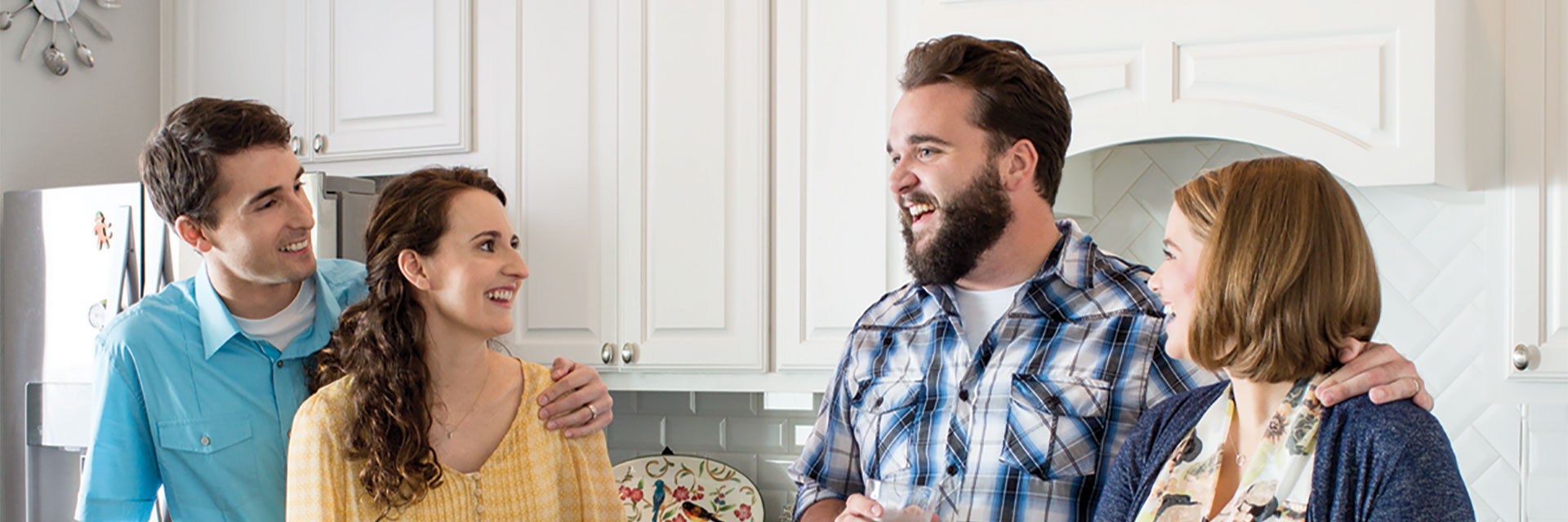 Group of friends talking in kitchen