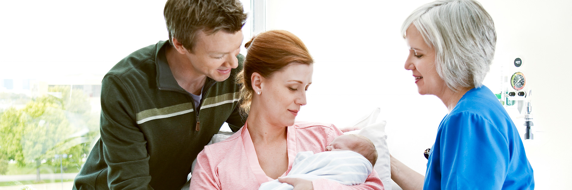 Couple with Nurse and Baby