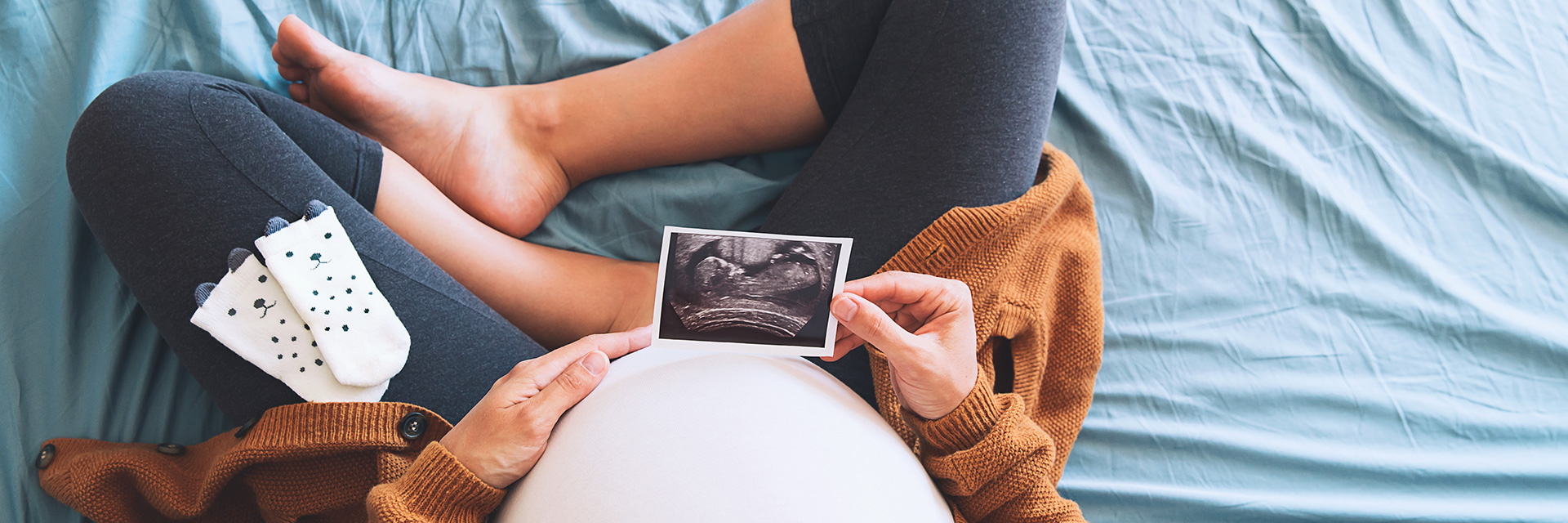 Pregnant Woman Holding Ultrasound