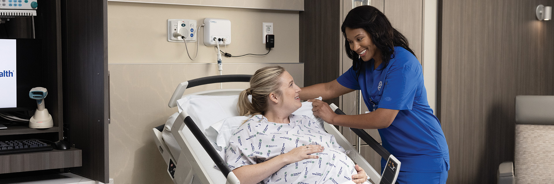 Pregnant woman in hospital bed