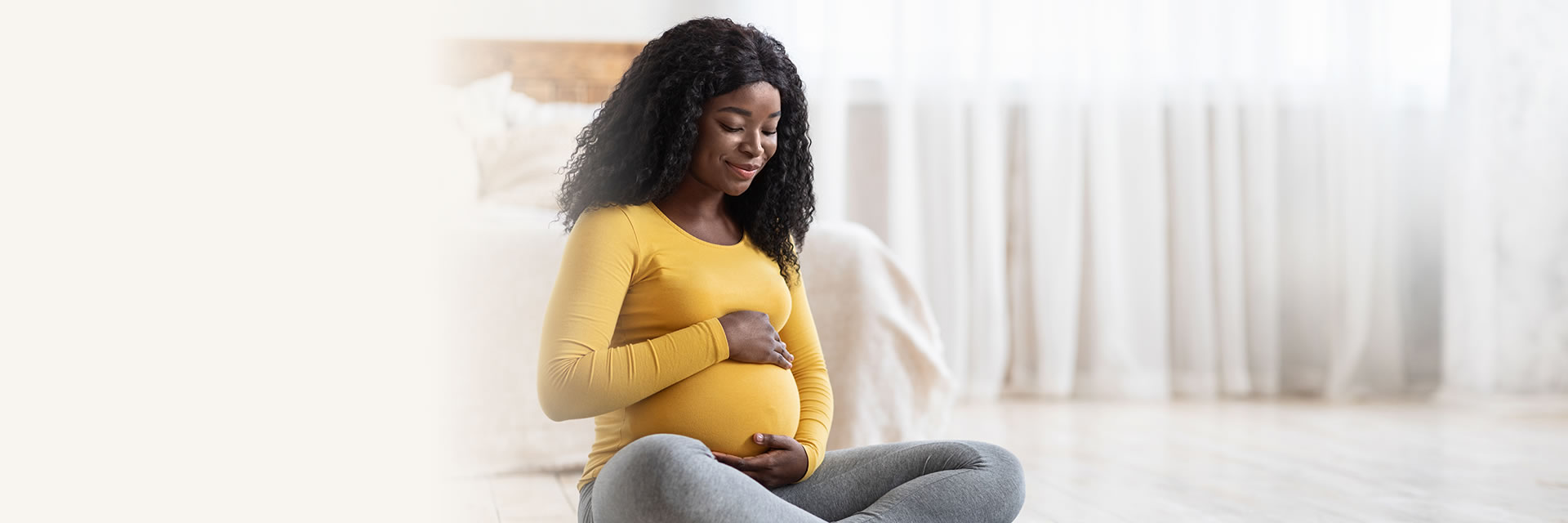 Pregnant Woman Holding Stomach