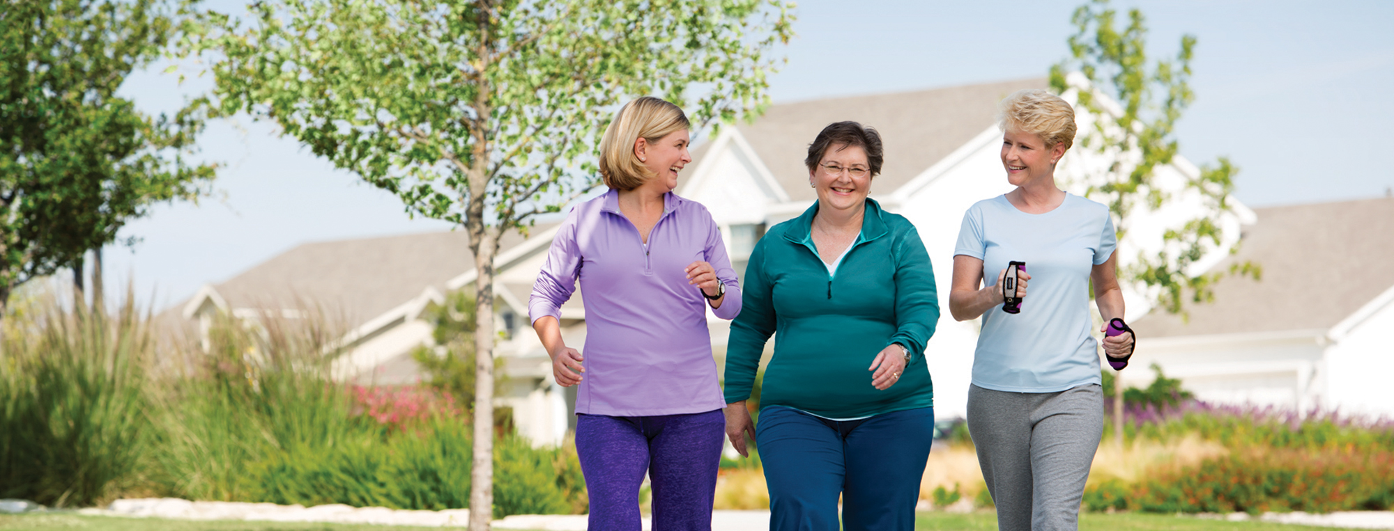 Three women exercising outdoors