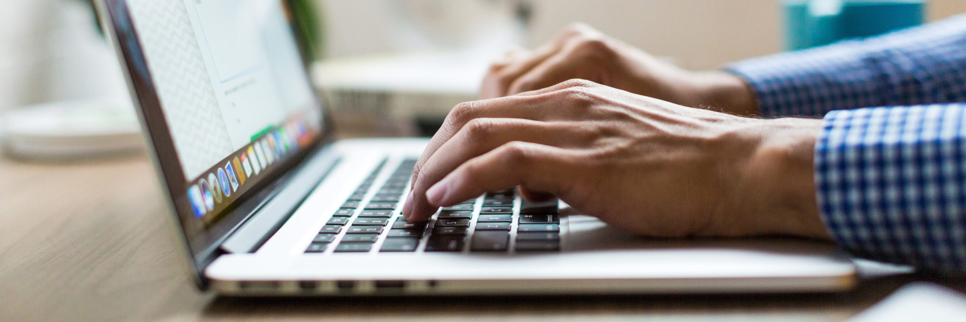 Person typing on laptop