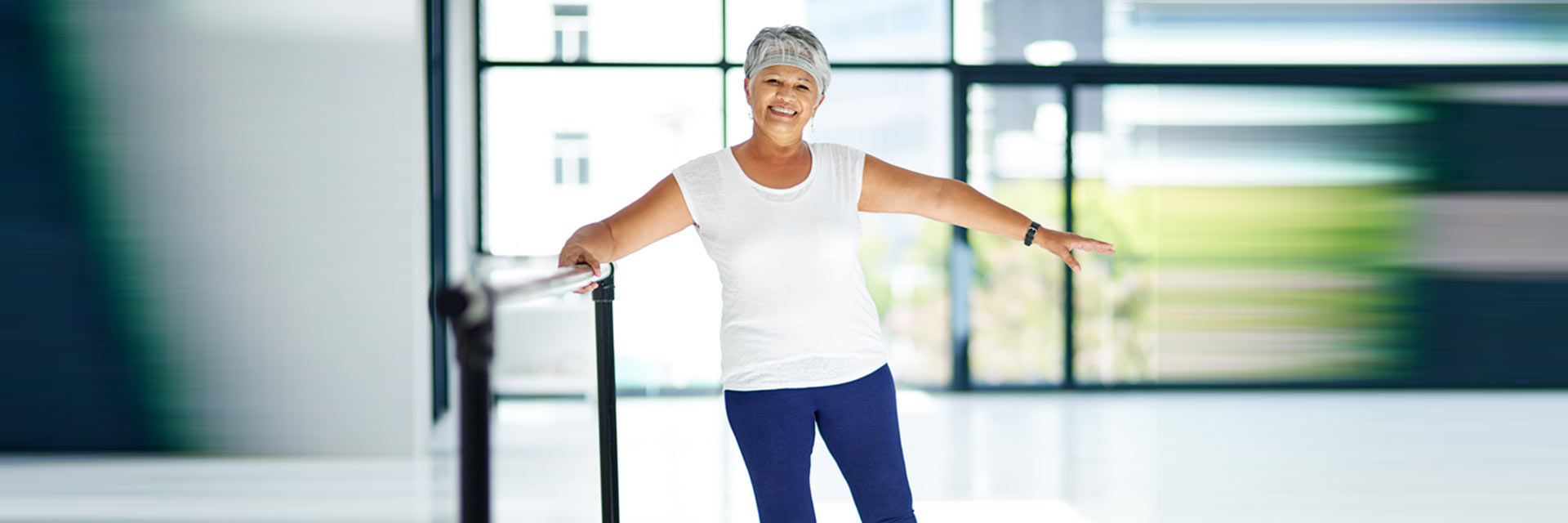 Woman exercising at Barre