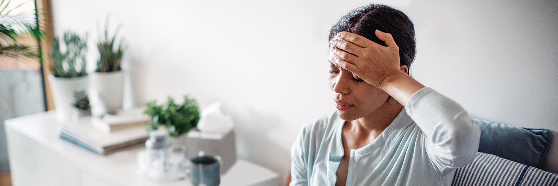 Woman holding head