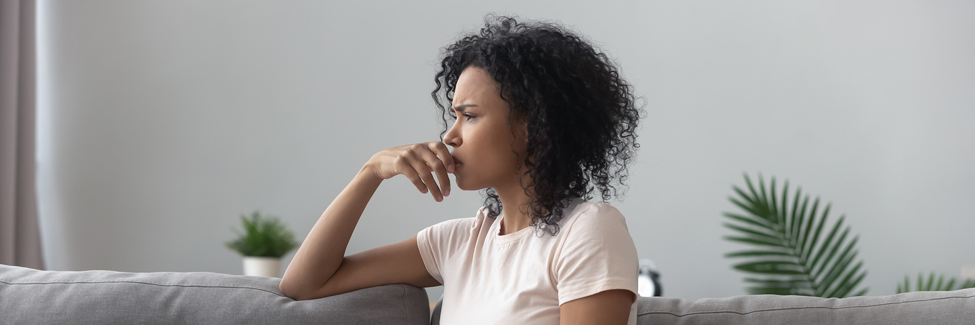 Woman sad on couch