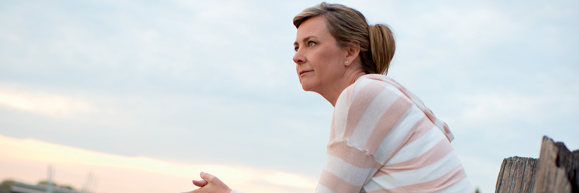 Woman Sitting on Dock