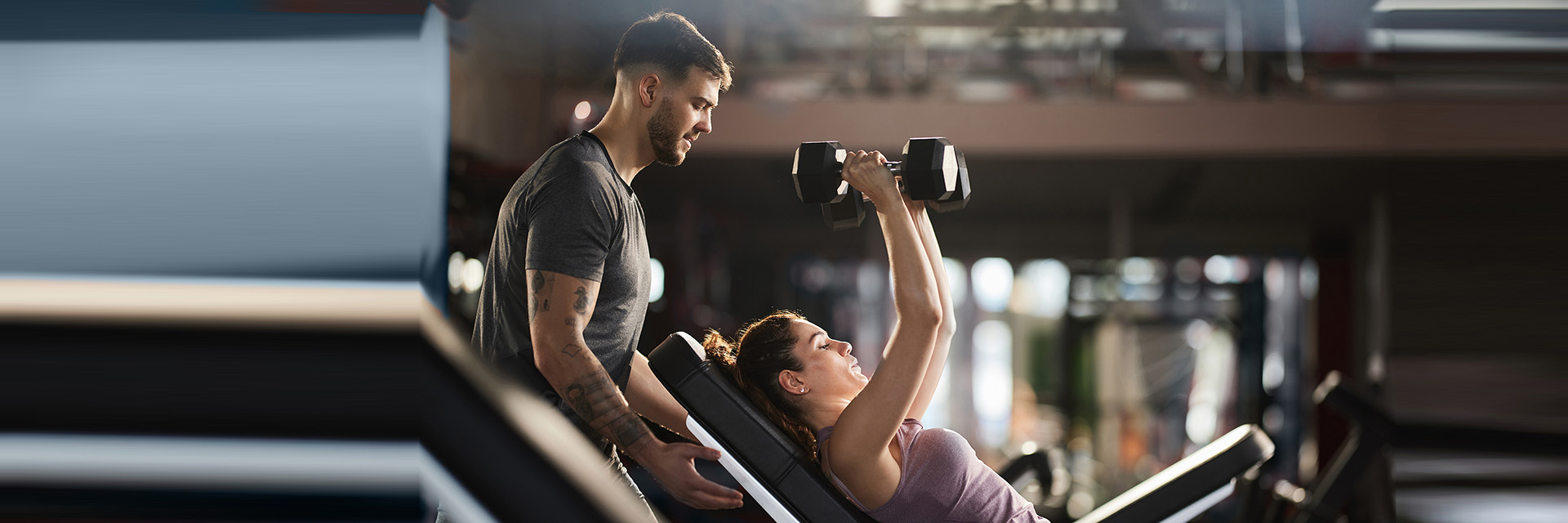 Woman working out with trainer