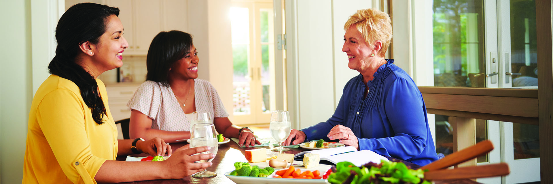 Women Eating at Table Indoors