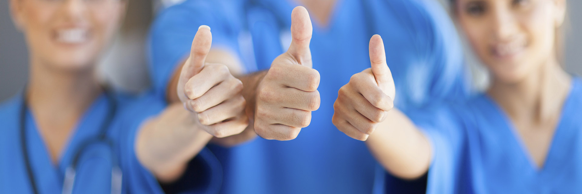 Healthcare Workers Giving the Thumbs Up