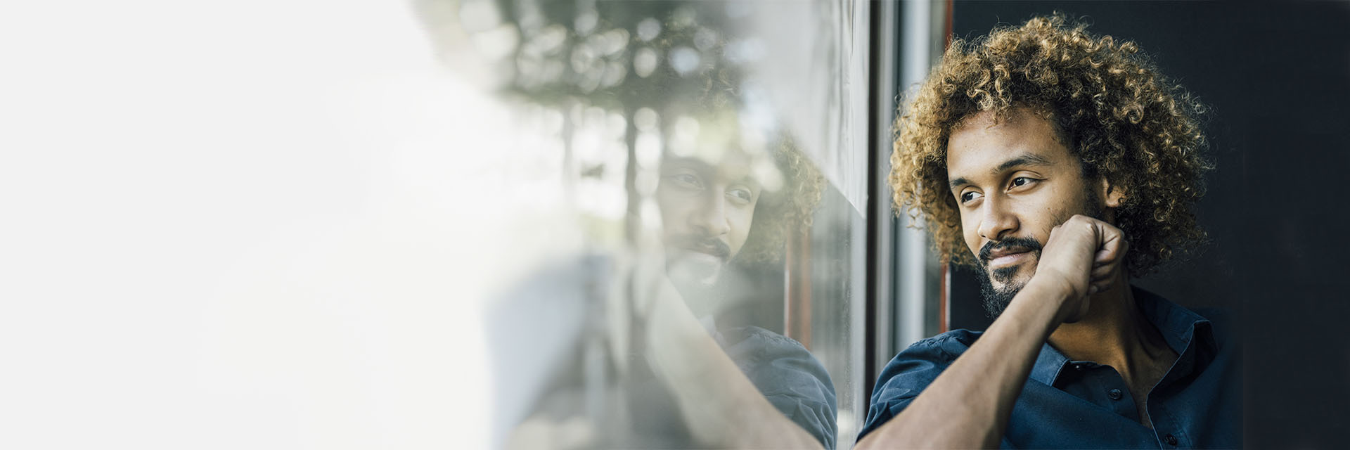 Man looking out the window