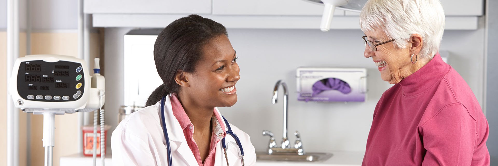 Doctor Speaks to Mature Patient