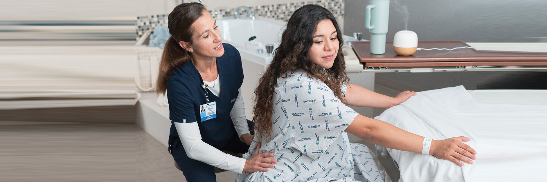 Nurse helping pregnant patient