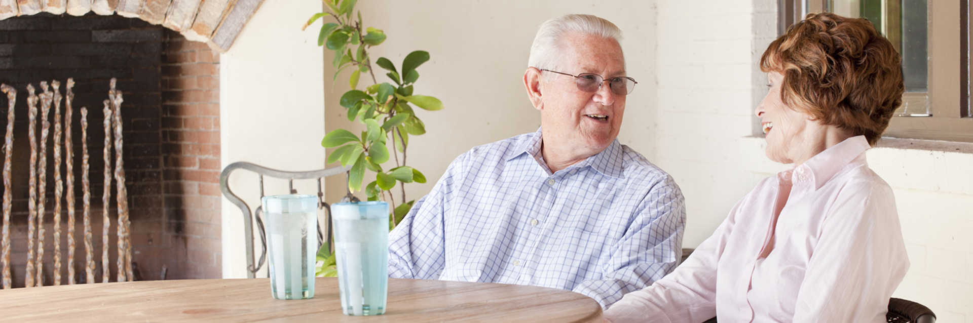 Older couple sitting at a table talking