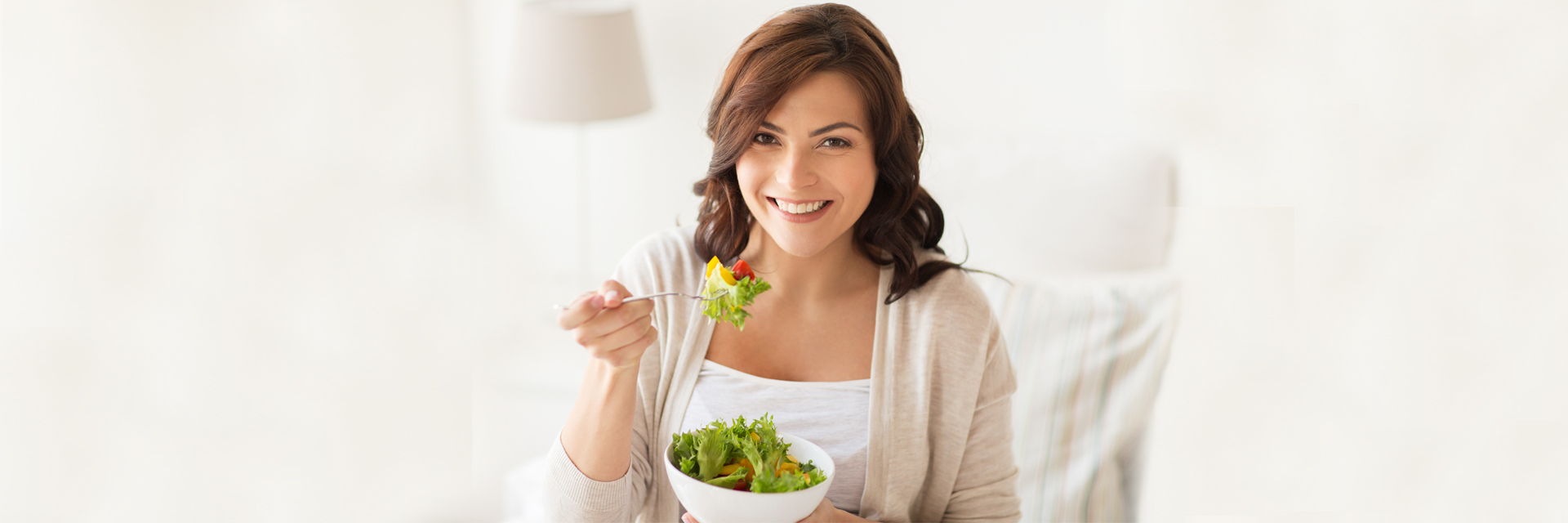 Woman eating salad