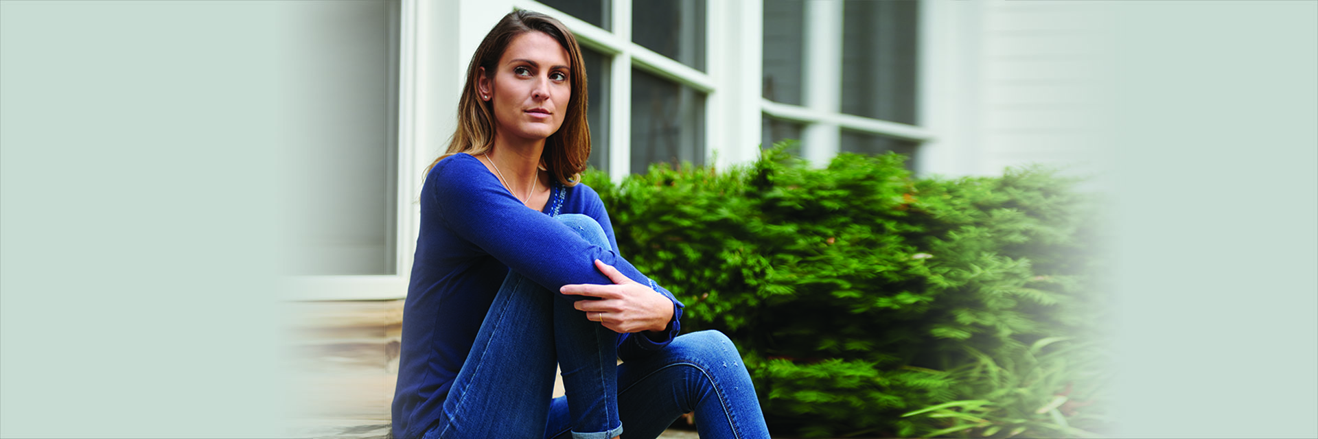 Woman Sitting on Steps looking Serious