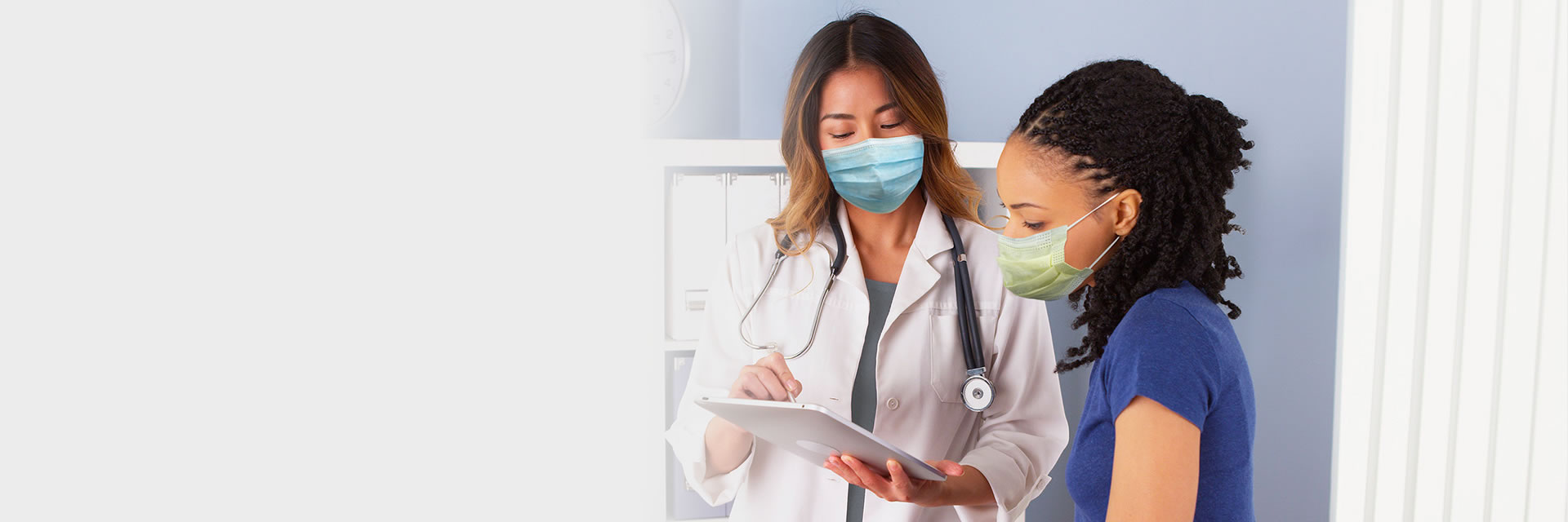 Doctor with patient using tablet
