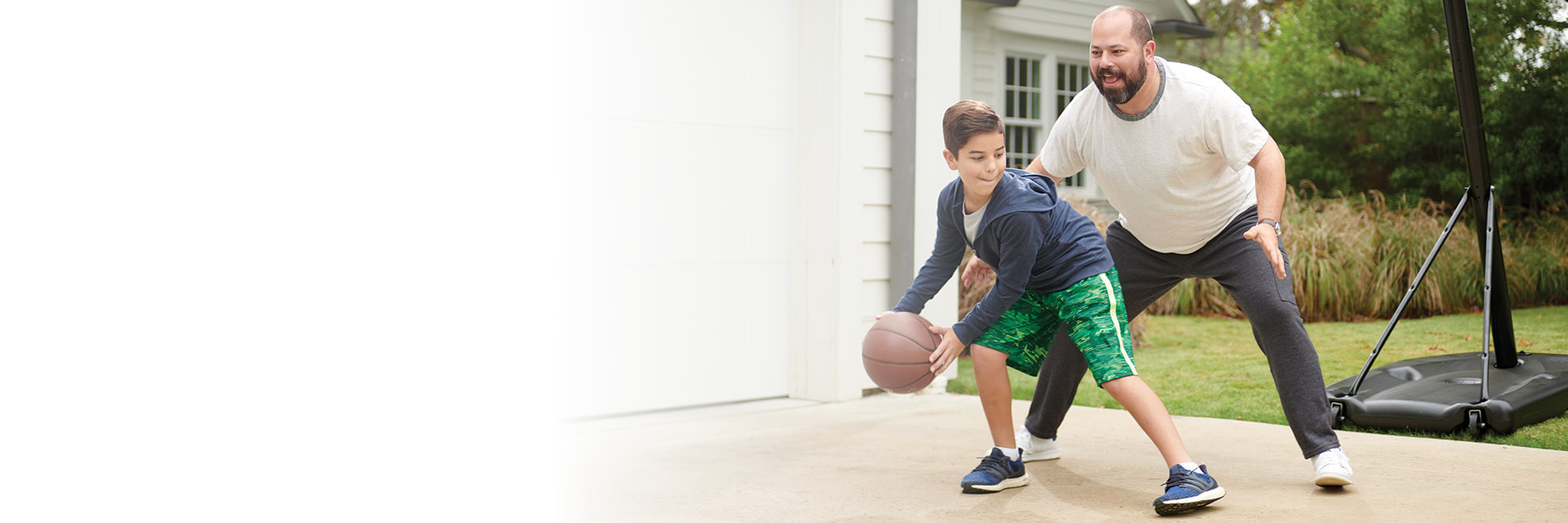 Father and son playing basketball