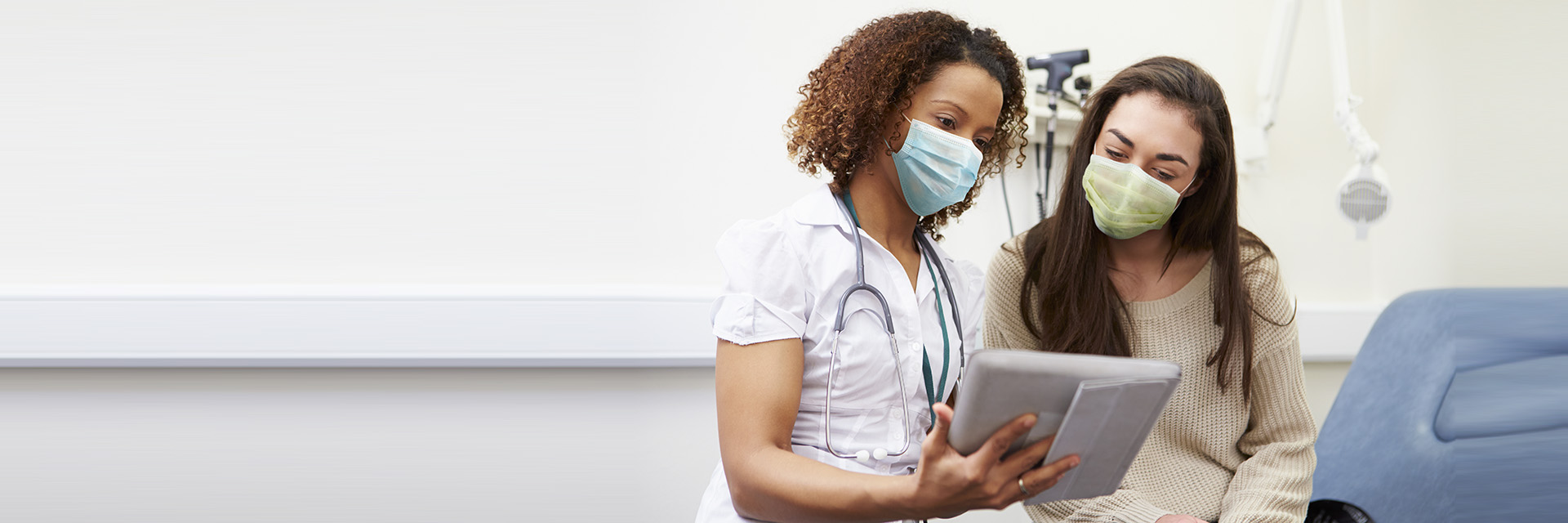 Provider with patient looking at tablet