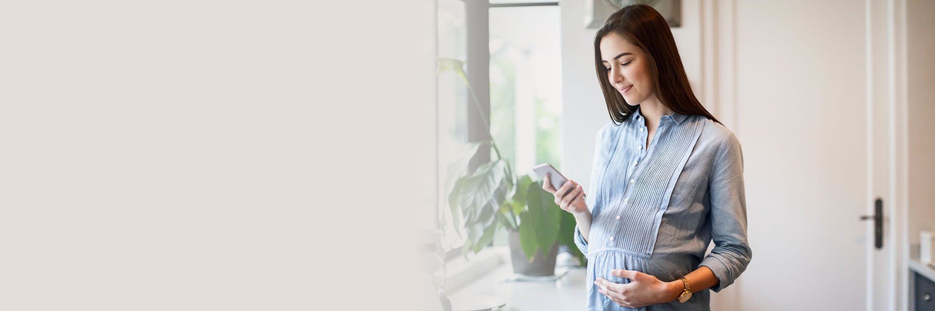 Pregnant woman using phone