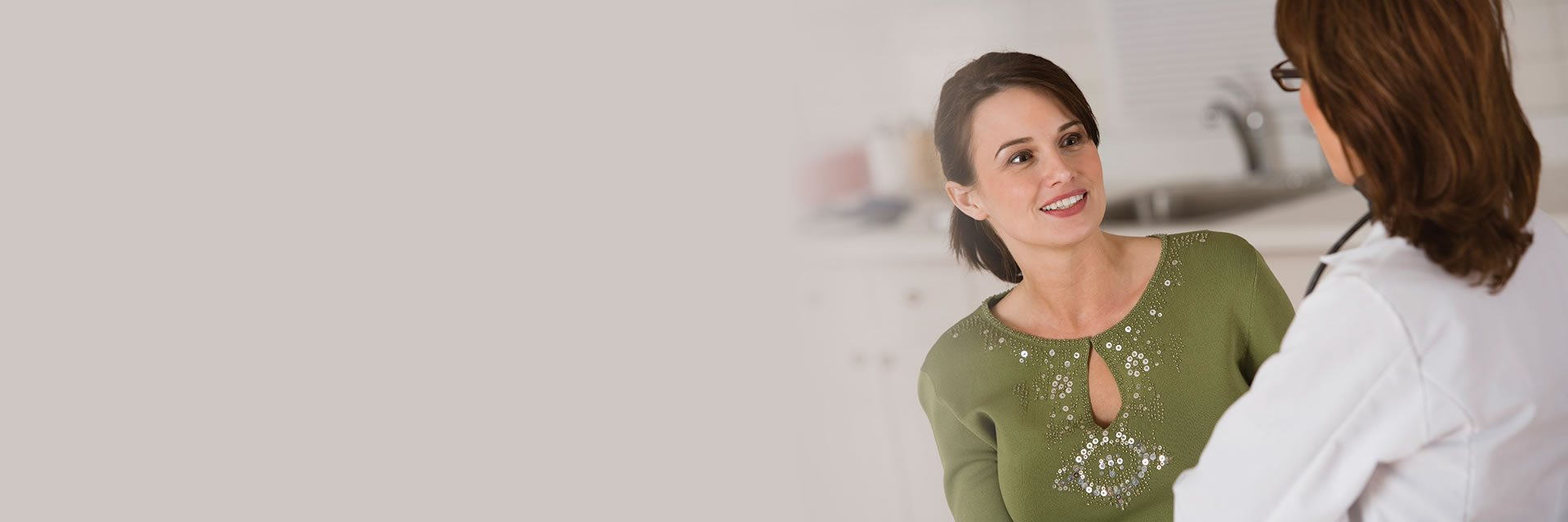 Woman talking to doctor