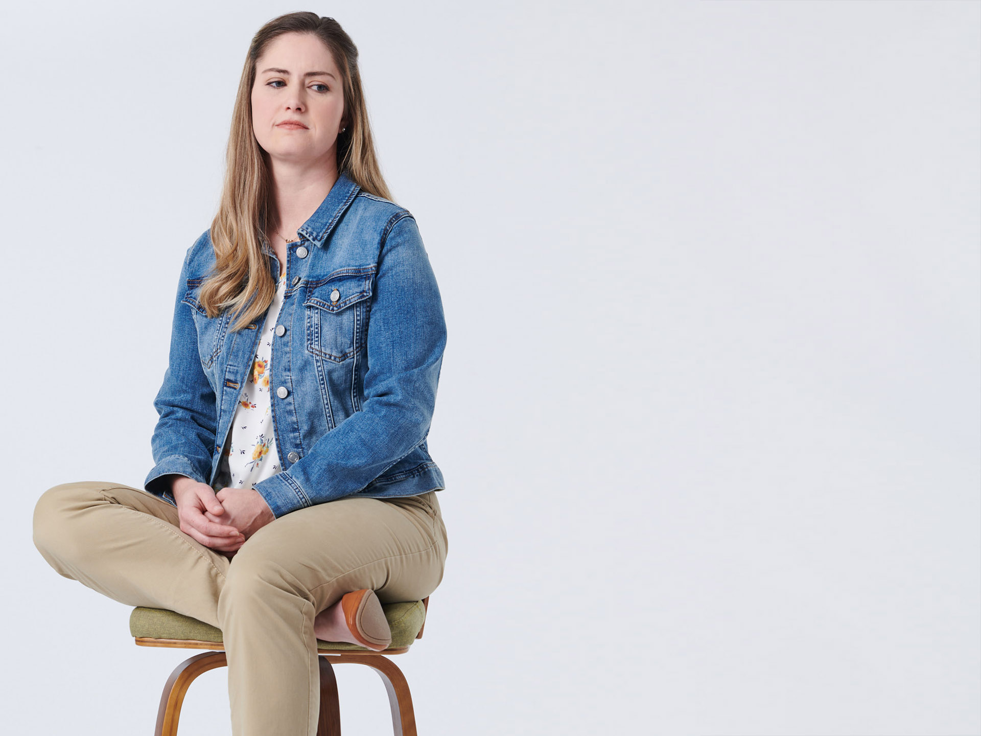 Woman sitting on bar stool