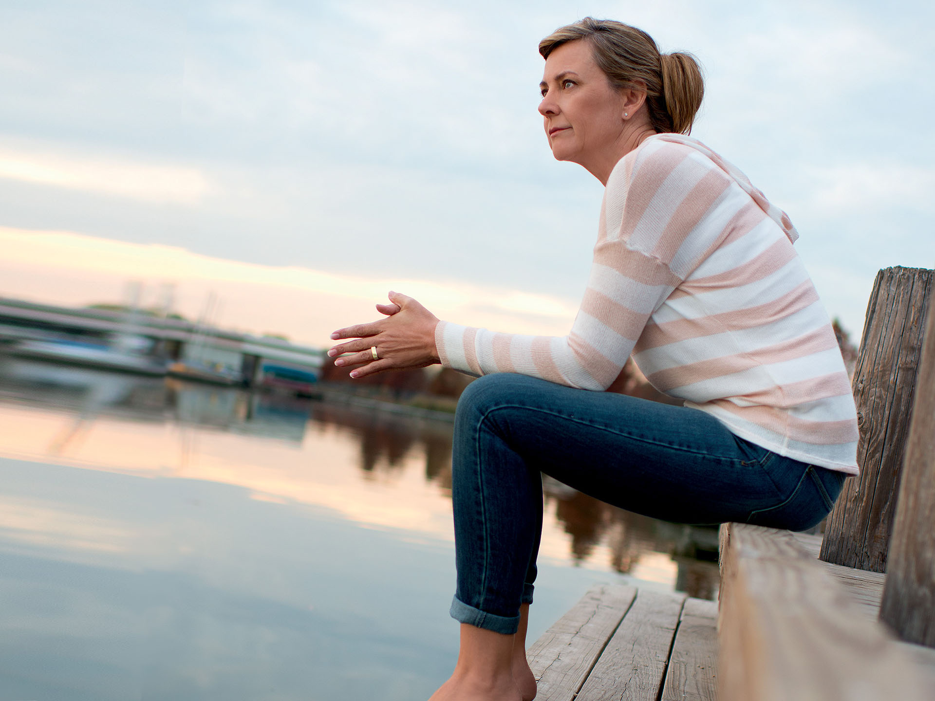 Woman Sitting on Dock