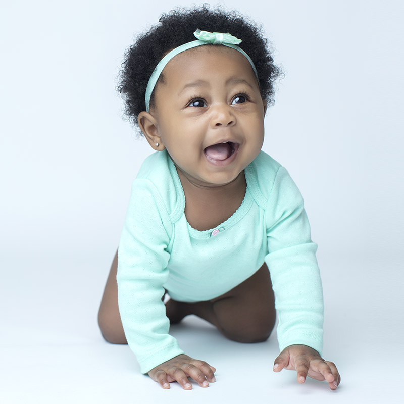 Crawling Baby on Light Blue Background