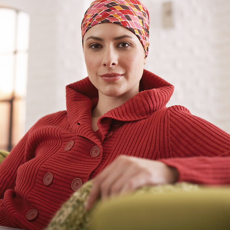 Woman Wearing Head Scarf Sitting with Her Laptop