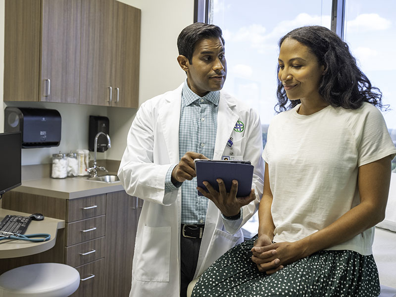 Woman reviewing information with doctor