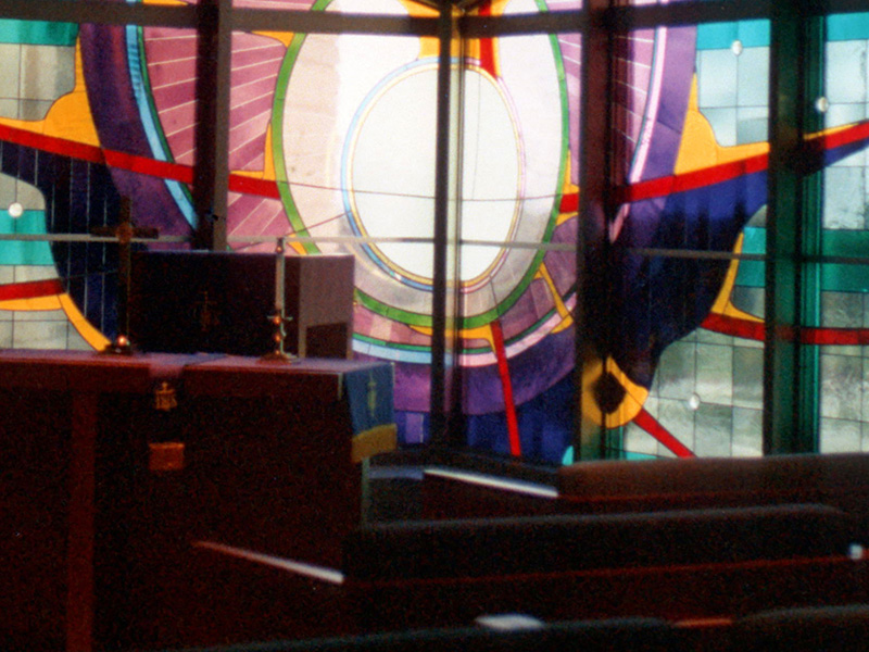 Stained Glass Behind Podium in Plano Chapel