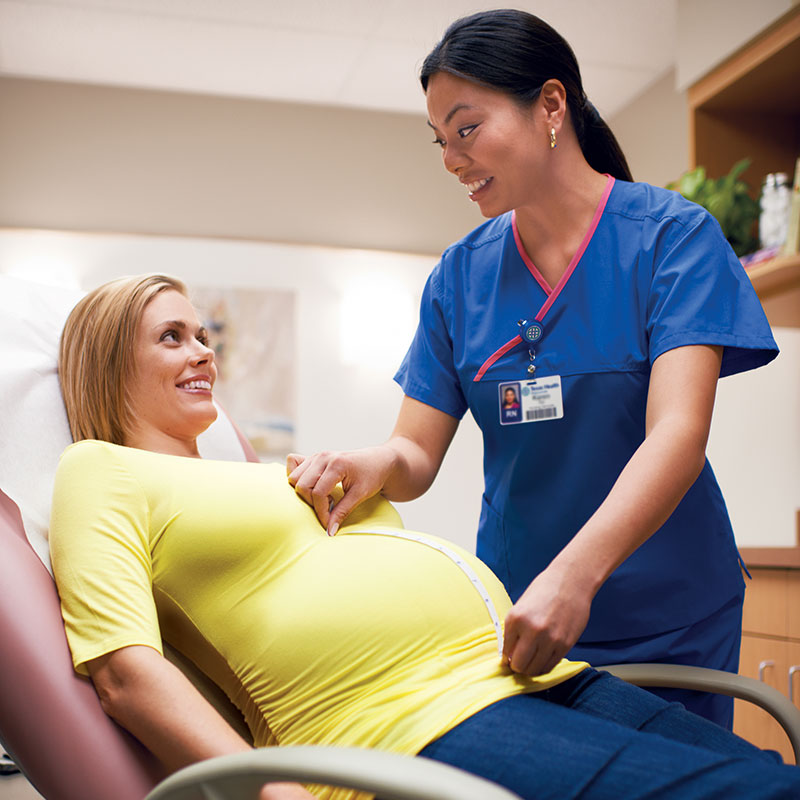 Pregnant Woman Getting Stomach Measured