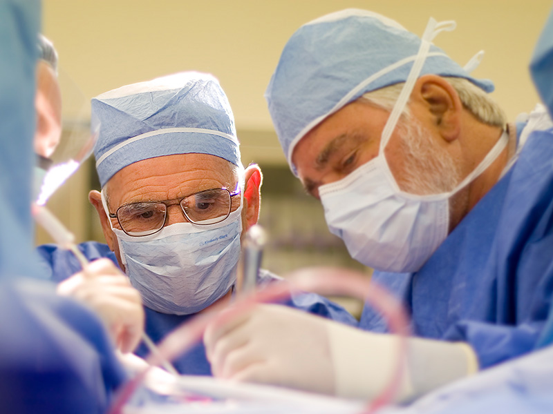 Two doctors performing surgery