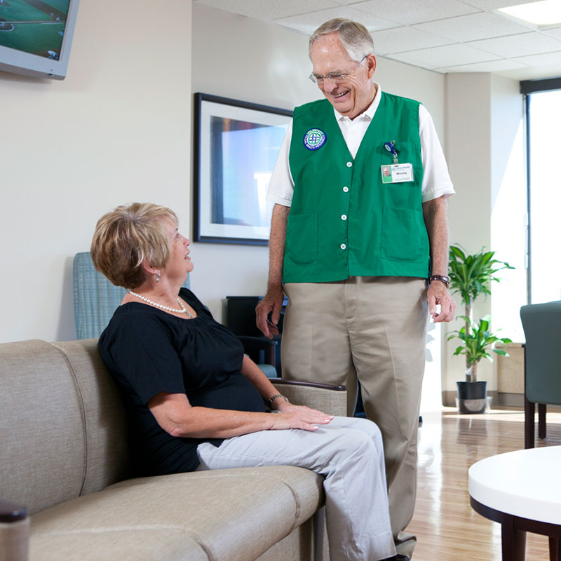 Volunteer talking to woman