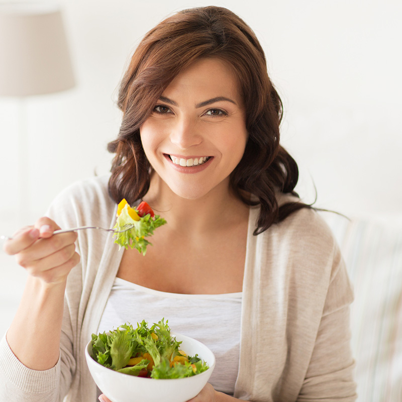 Young Woman Eating a Healthy Salad