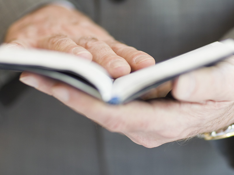 Chaplin Holding Prayer Book