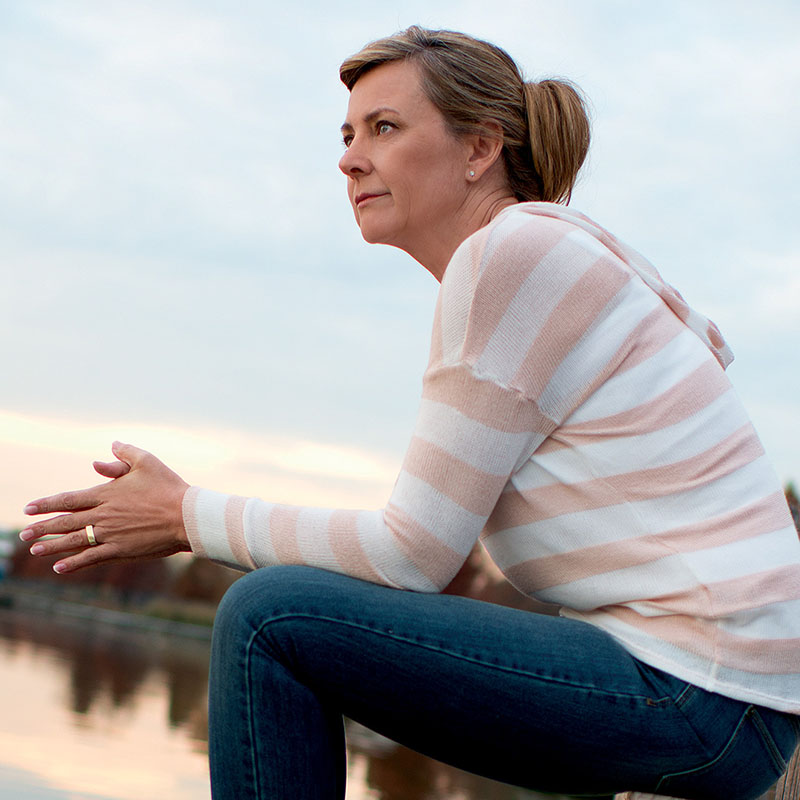 Woman Sitting on Dock