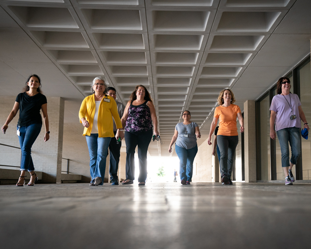 Women walking down a garage tunnel